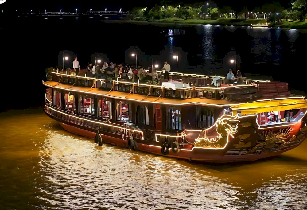Relaxing experience sitting on a boat on the Perfume River listening to Hue folk songs